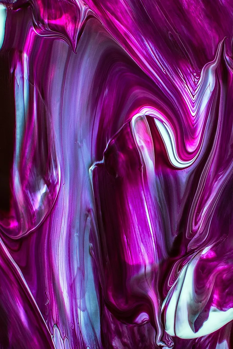 Fluid abstract painting in violet, magenta, and pale blue